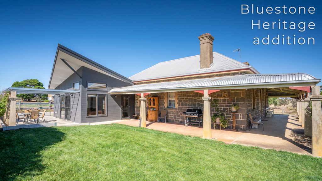 Contemporary bluestone house extension with patio