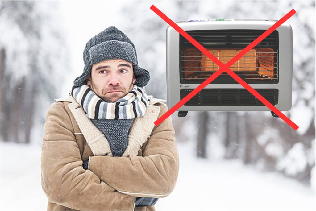 Cold person outside, heater with red cross.